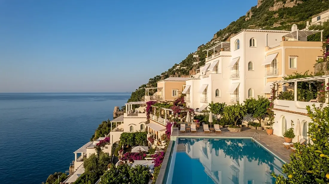 Marivento's whitewashed terraces stepping down the cliff to an infinity pool above the sea