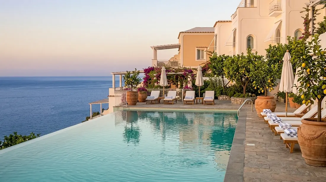Infinity pool on a cliff terrace at golden hour
