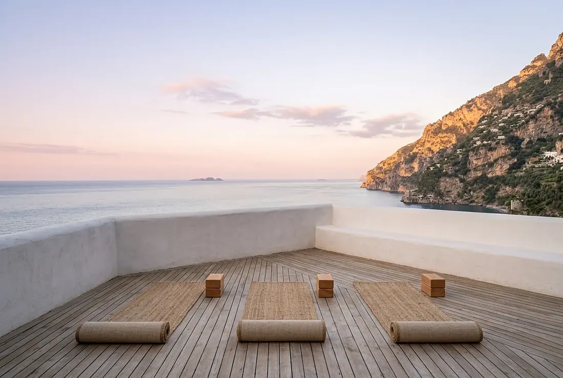 Yoga mats on a cliff-top deck at sunrise